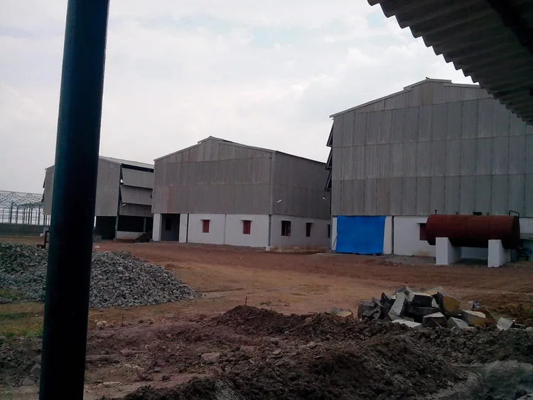 A view across the yard toward S.S. Chemicals factory buildings